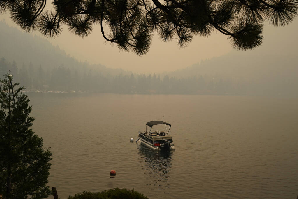 Smoke from the Caldor fire shrouds Fallen Leaf Lake near South Lake Tahoe, Tuesday, Aug. 24, 2021.  (AP Photo/Rich Pedroncelli)
