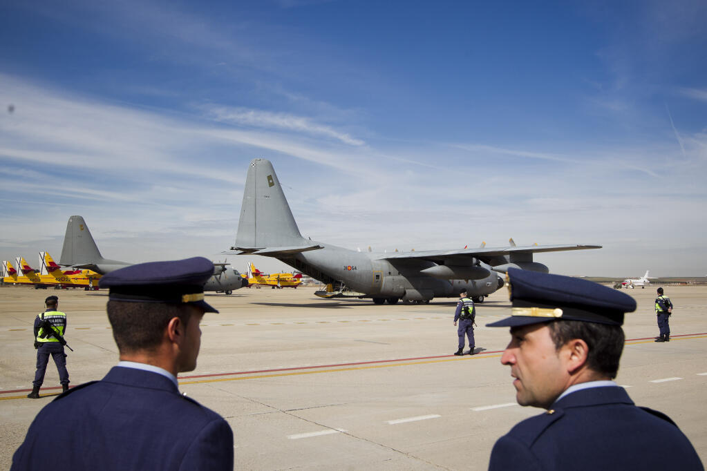 FILE - Two Spanish military C-130 aircrafts are seen at the military airbase of Torrejon De Ardoz in Madrid, Feb. 25, 2012. Spain's defense ministry said on Thursday, Dec. 1, 2022 an explosive package was sent at the air base contained a suspect mechanism. Extra security forces were deployed to the Torrejon de Ardoz base, just east of Madrid. It said the package was sent to base's European Union Satellite Center.(AP Photo/Daniel Ochoa de Olza, File)