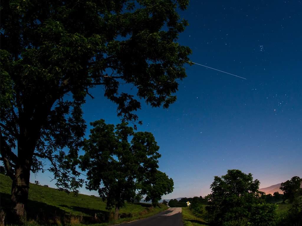 The International Space Station is seen in this 30 second exposure as it flies over Elkton, VA early in the morning, Saturday, August 1, 2015. (Photo: NASA/Bill Ingalls)