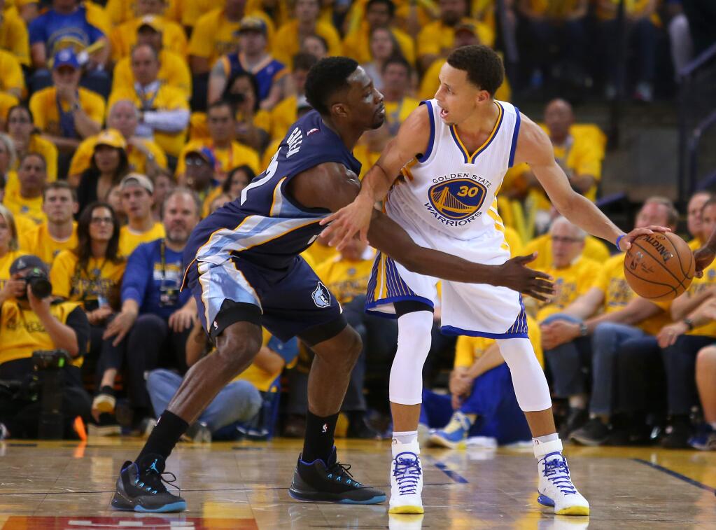Golden State Warriors guard Stephen Curry calls for a screen while defended by Memphis Grizzlies forward Jeff Green during Game 1 of the NBA Playoffs Western Conference Semifinals at Oracle Arena, in Oakland on Sunday, May 3, 2015. The Warriors defeated the Grizzlies 101-86.(Christopher Chung/ The Press Democrat)