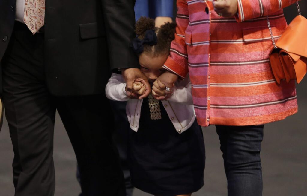 Riley Curry, center, Golden State Warriors guard Stephen Curry's daughter, center, walks him for the NBA's Most Valuable Player award basketball news conference Tuesday, May 10, 2016, in Oakland, Calif. (AP Photo/Ben Margot)