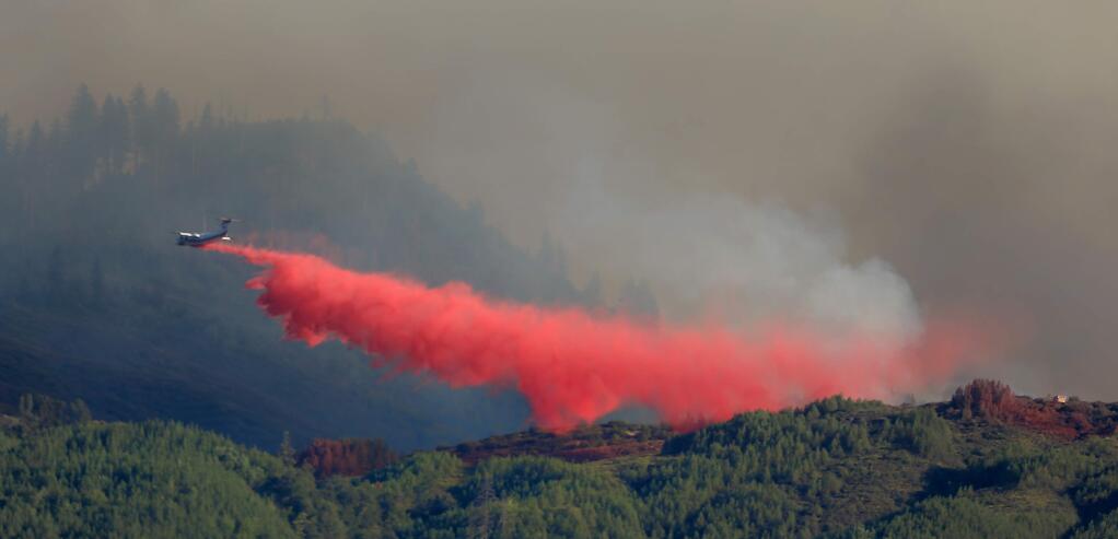(FILE PHOTO) Fire retardant is dropped on the head of the Elk fire along Pitney Ridge in the Mendocino National Forest, Wednesday Sept. 2, 2015 in Upper Lake. (Kent Porter / Press Democrat) 2015