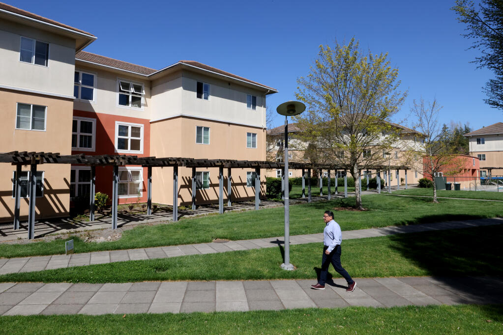 Mike Lee, the SSU interim president, walks from his apartment-style student housing unit to his office at Salazar Hall at Sonoma State University in Rohnert Park, Monday, April 10, 2023. (Beth Schlanker / The Press Democrat file)