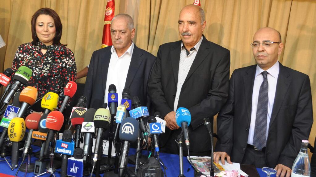 Representatives of the Tunisian National Dialogue Quartet attend a press conference Friday in Tunis after winning the Nobel Peace Prize. (Xinhua)