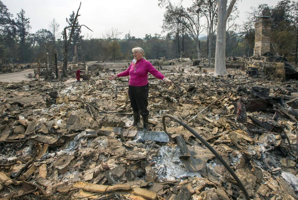 Marjorie Everidge surveys what is left of the Glen Ellen home she lived in for 63 years. (Photo by Robbi Pengelly/Index-Tribune)