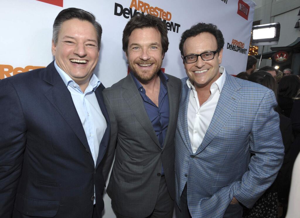 FILE - In this April 29, 2013, file photo, Ted Sarandos, Jason Bateman, and Mitchell Hurwitz attend the season four premiere of 'Arrested Development' at the TCL Chinese Theatre in Los Angeles. Netflix announced on May 17, 2017, that the series would return for a fifth season in 2018. (Photo by John Shearer/Invision/AP, File)