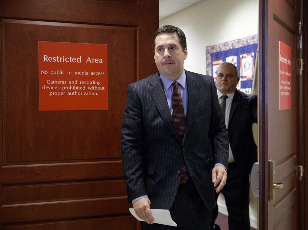 House Intelligence Committee Chairman Rep. Devin Nunes, R-Calif. arrives to give reporters an update about the ongoing Russia investigation, Wednesday, March 22, 2017, on Capitol Hill in Washington. Nines said President Donald Trump's communications may have been 'monitored' during the transition period as part of an 'incidental collection.' (AP Photo/J. Scott Applewhite)