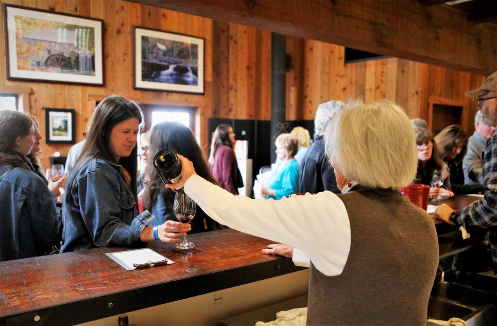 A guest at Mill Creek Winery sampled a new release wine Sunday. The 26th Annual Winter WINEland featured over 100 wineries in Northern Sonoma County, January 13-14, 2018. Participants met winemakers, tasted limited production wines and new releases. (photo Will Bucquoy/for the Press Democrat).