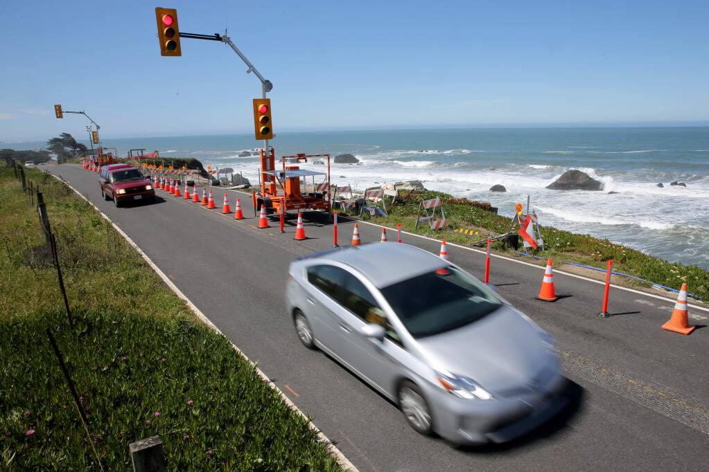 Cars drive on Highway 1, after the southbound lane was closed at Gleason Beach north of Bodega Bay, California on Wednesday, May 22, 2019. (BETH SCHLANKER/The Press Democrat)