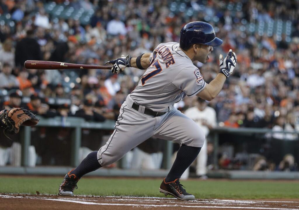 Houston Astros' Jose Altuve hits a single off San Francisco Giants starting pitcher Madison Bumgarner in the first inning of their baseball game, Tuesday, Aug. 11, 2015, in San Francisco. (AP Photo/Eric Risberg)