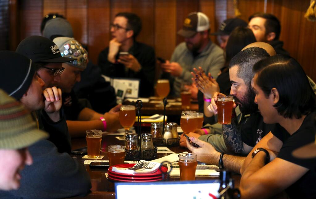 Beer lovers from around the world stood in line for their chance to taste Pliny the Younger at Russian River Brewing Company in Santa Rosa on Friday. (JOHN BURGESS / The Press Democrat)