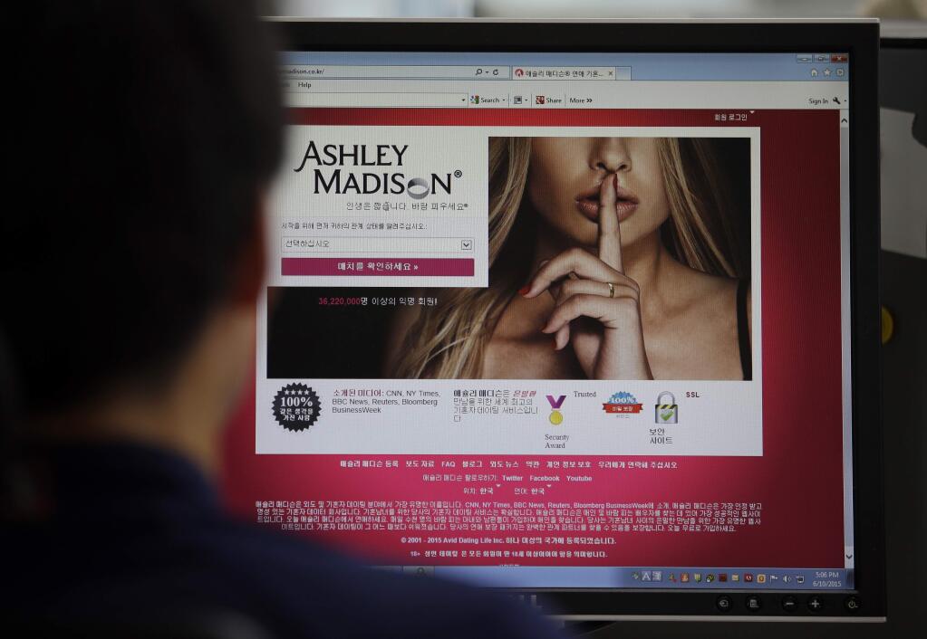 FILE - A June 10, 2015 photo from files showing Ashley Madison's Korean web site on a computer screen in Seoul, South Korea. Hackers claim to have leaked a massive database of users from Ashley Madison, a matchmaking website for cheating spouses. In a statement released Tuesday, Aug. 18, 2015, a group calling itself Impact Team said the site's owners had not bowed to their demands. 'Now everyone gets to see their data,' the statement said. (AP Photo/Lee Jin-man, File)
