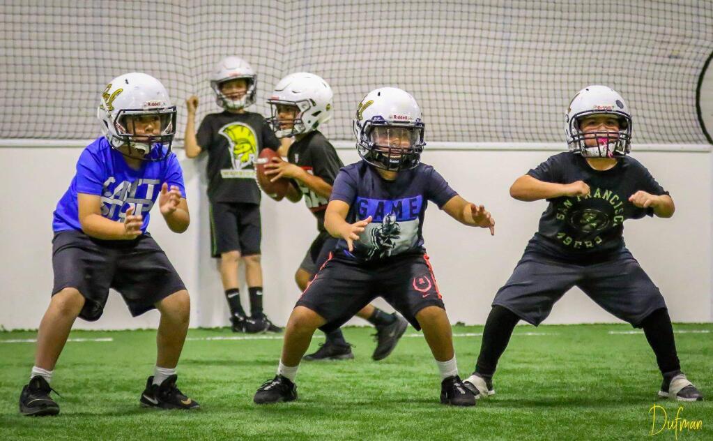 The Redwood PAL Golden Bears Mighty Mite football squad works out at a recent practice. (Redwood PAL Golden Bears)