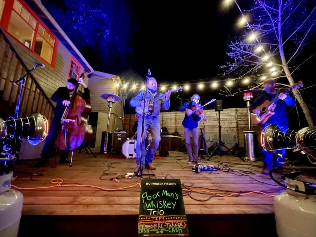 Poor Man’s Whiskey performs at a recent “In Your Driveway (or Backyard) Concert Series” show in Sebastopol. (KC Turner)
