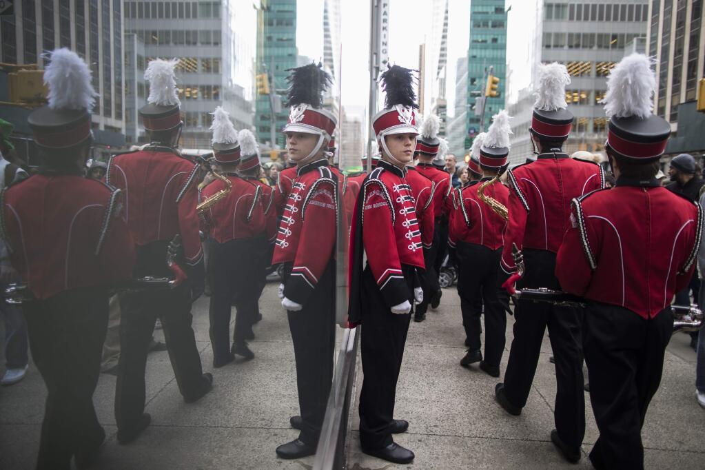 Members of a band line up before marching up Fifth Avenue during the St. Patrick's Day Parade, Saturday, March 16, 2019, in New York. (AP Photo/Mary Altaffer)