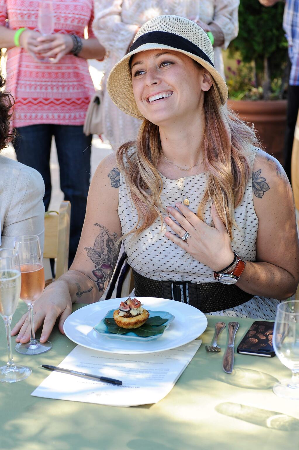 Brooke Williamson, 'Top Chef' season 10 runner-up and lead judge in the 2015 Glorious Bites competition, savors one of the finalists, brioche bites with pate, shallots, blue cheese and figs from finalist Jamie Brown-Miller of Napa, California.(Photo by Michale Angelo Grassia)