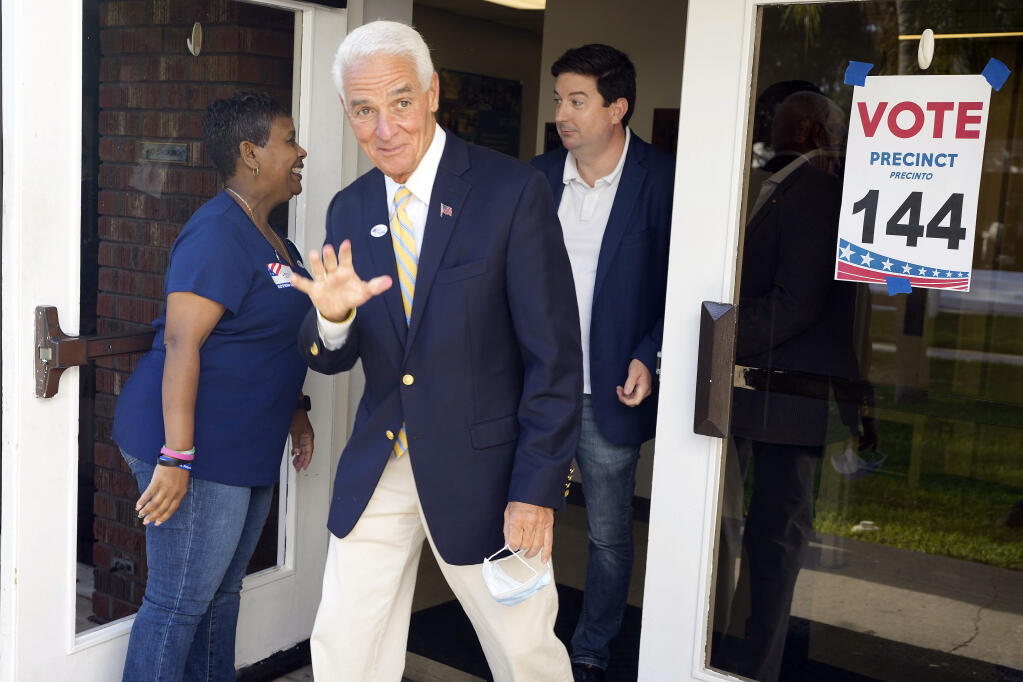U.S. Rep Charlie Crist, D-Fla., waves to photographers after voting Tuesday, Aug. 23, 2022, in St. Petersburg, Fla. Crist is running for Florida Governor against Agriculture Commissioner Nikki Fried in the primary election. (AP Photo/Chris O'Meara)