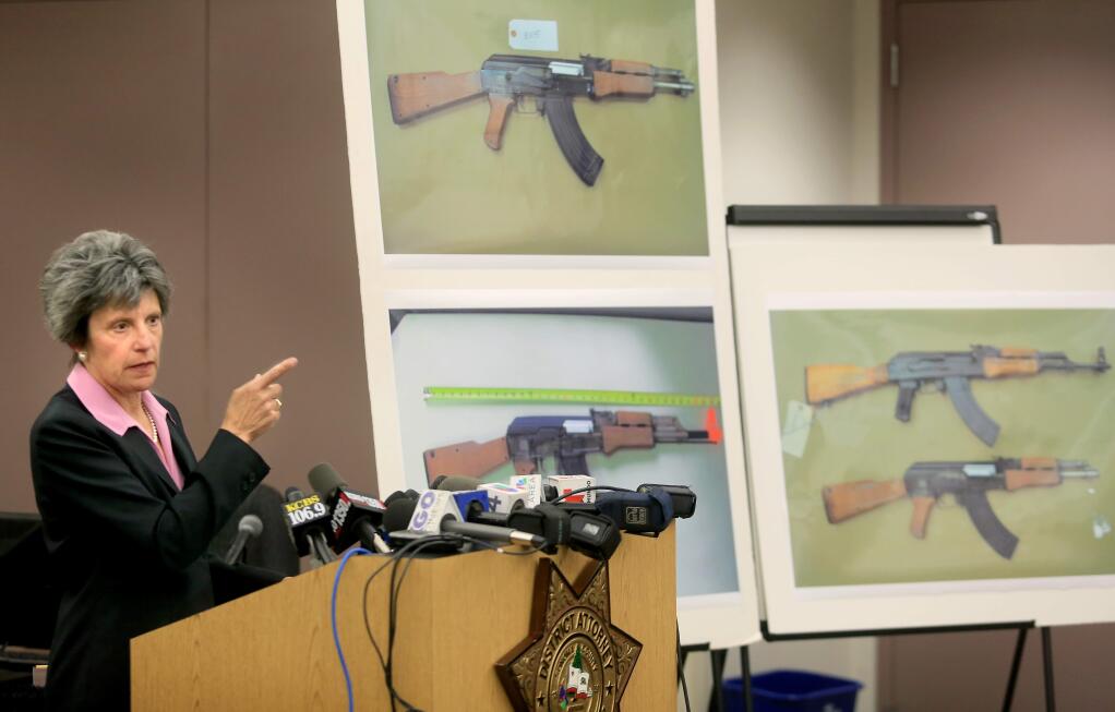 Jill Ravitch, Sonoma County District Attorney, will not file criminal charges against a sheriff's deputy who shot and killed 13-year-old Andy Lopez, Monday July 7, 2014 announced during a press conference at the Permit and Resource s Management Department at the county center in Santa Rosa. The photos show what Lopez was carrying, at top left, what a new gun looks like at bottom left with orange tip, at right shows a real AK 47 top, and the Lopez gun, bottom. (Kent Porter / Press Democrat) 2014
