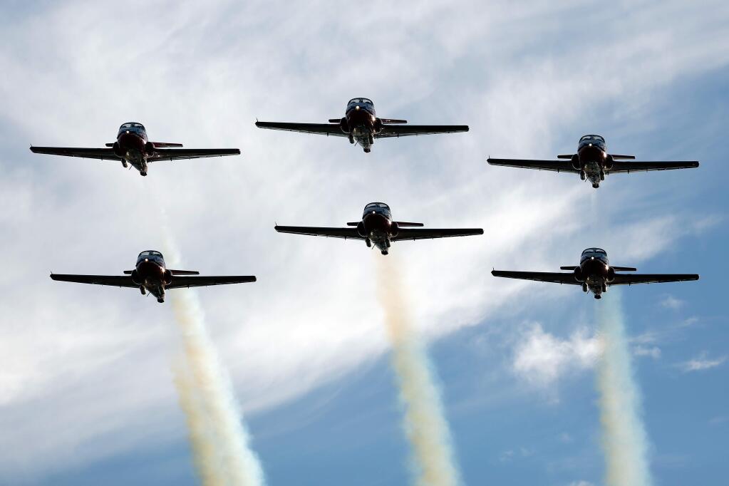 Members of the Canadian Forces Snowbirds air demonstration squadron makes a fly-by in formation as they arrive at Sonoma County Airport in Santa Rosa, California on Thursday, September 24, 2015 for the Wings Over Wine Country Airshow. (Alvin Jornada / The Press Democrat)