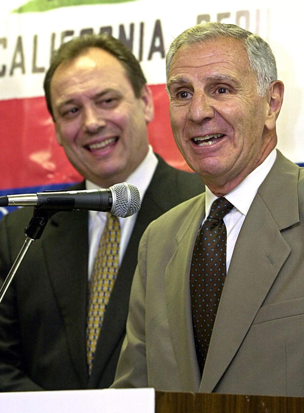 FILE -- In this June 20, 2001 file photo, Republican gubernatorial candidate, Secretary of State Bill Jones, left, looks on as former California Gov. George Deukmejian answers questions during a news conference in Sacramento, Calif. A former chief of staff says two-term California governor George Deukmejian, whose anti-spending credo earned him the nickname 'The Iron Duke,' has died at age 89. Steve Merksamer says Deukmejian died Tuesday, May 8, 2018, of natural causes. (AP Photo/Rich Pedroncelli, File)