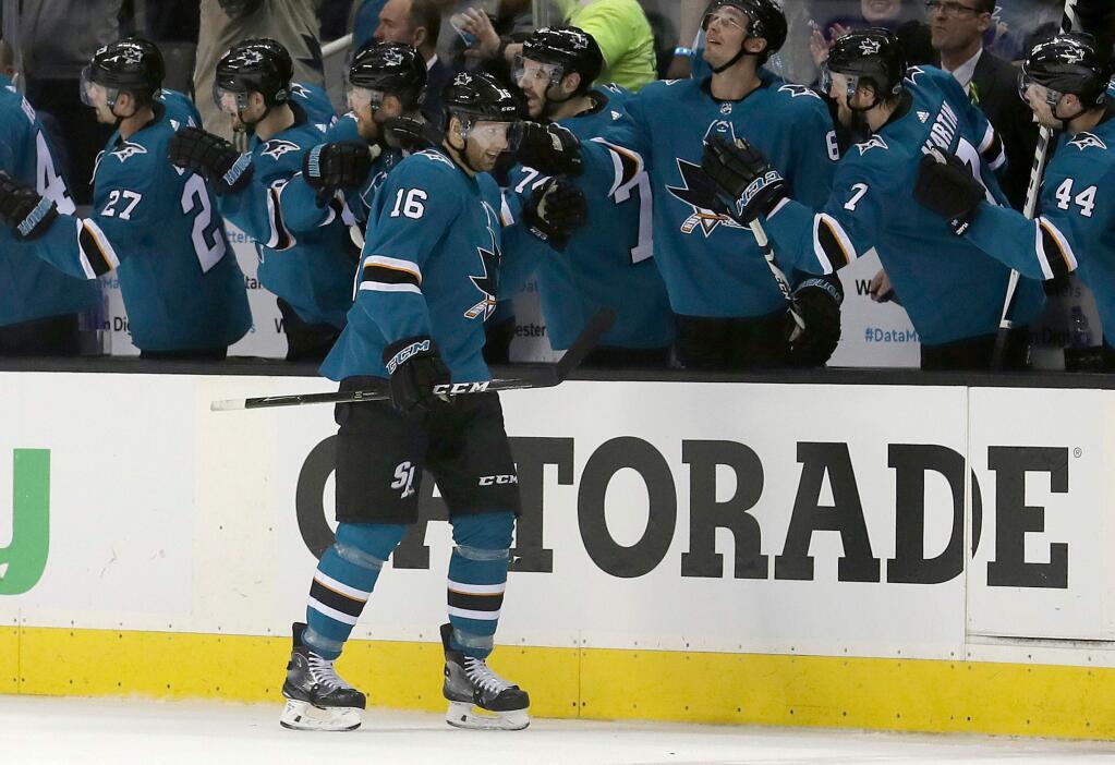 In this April 16, 2018, file photo, San Jose Sharks center Eric Fehr (16) is congratulated by teammates after scoring a goal against the Anaheim Ducks during the second period of Game 3 of their first-round playoff series in San Jose. (AP Photo/Jeff Chiu, File)