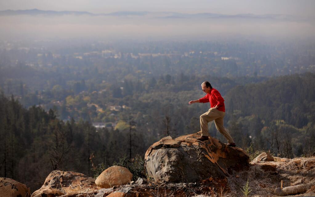 The view from Jim Finn's lot in Fountaingrove is stunning, but the Tubbs fire razed his home and left heat cracked boulders and fried trees, Wednesday, October 16, 2019 in Santa Rosa. Just recently, Finn settled with his insurance company but is unsure he will be rebuild. (Kent Porter / The Press Democrat)