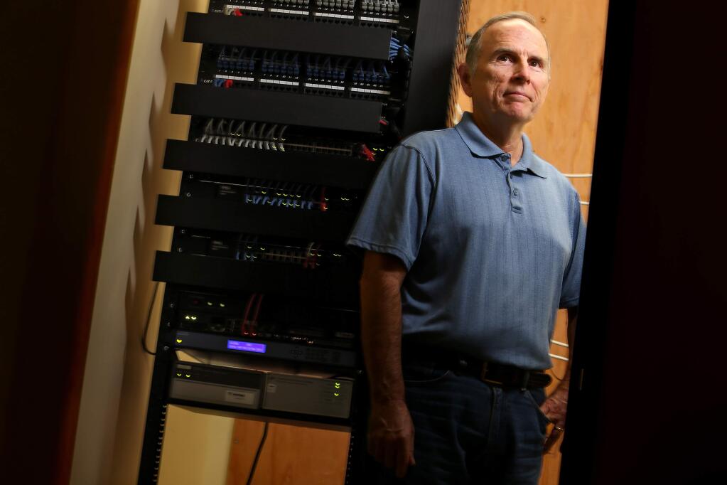 Senior software developer Terry Haynes in the Venture Design Services server room, which is connected to Sonic.net Gigabit Fiber Internet. The office located at the business park network near the Sonoma County Airport has enjoyed an increase from 6 Mbps speeds to 1000 Mbps.(Christopher Chung/ The Press Democrat)