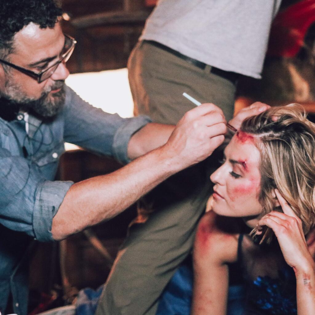 ALL HANDS ON DECK: Co-director Mitchell Altieri applies some extra wound effects to actress Scout Taylor Compton, on the set of 'Star Light'