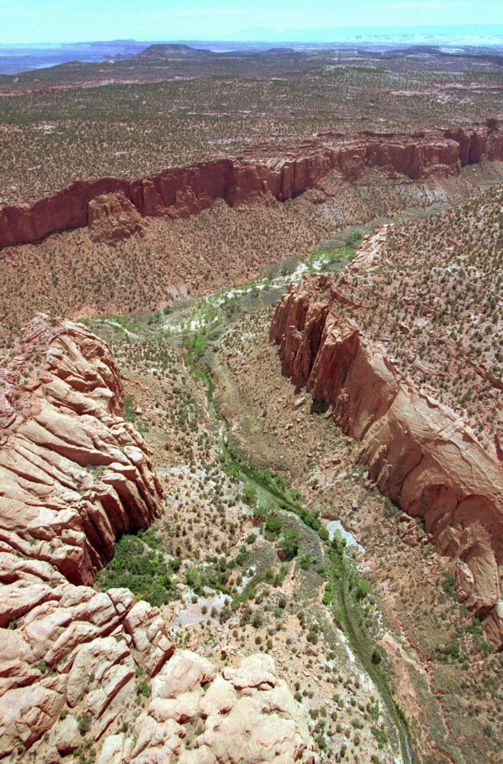 FILE - This May 30, 1997, file photo, shows the varied terrain of Grand Staircase-Escalante National Monument near Boulder, Utah. Interior Secretary Ryan Zinke is recommending that six of 27 national monuments under review by the Trump administration be reduced in size, along with management changes to several other sites. A leaked memo from Zinke to President Donald Trump recommends that two Utah monuments - Bears Ears and Grand Staircase Escalante - be reduced, along with Nevada's Gold Butte and Oregon's Cascade-Siskiyou. (AP Photo/Douglas C. Pizac, File)