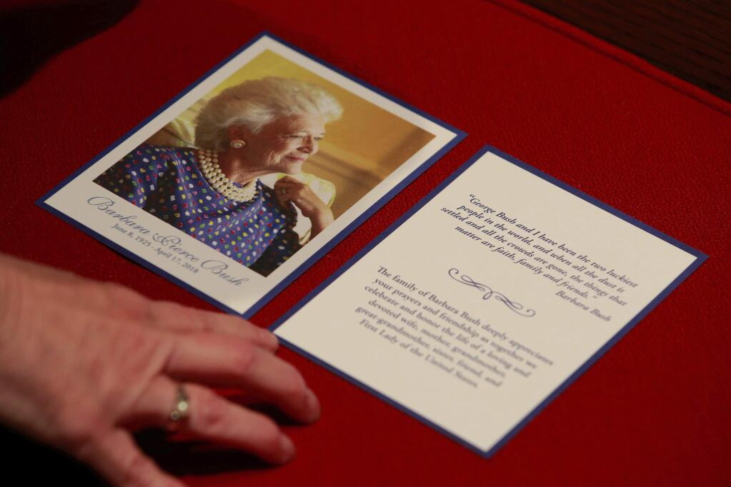 The program for services is seen as former first lady Barbara Bush lies in repose at St. Martin's Episcopal Church Friday, April 20, 2018, in Houston, prior to the public visitation. (Richard Carson/Pool via AP)