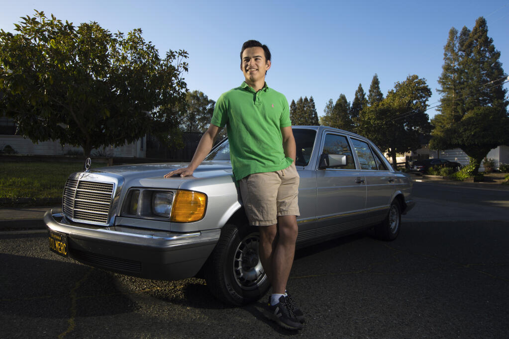 Joseph Silvi with the Mercedes he adapted to run on biodiesel on Monday, March 14, 2022. (Robbi Pengelly/Index-Tribune)