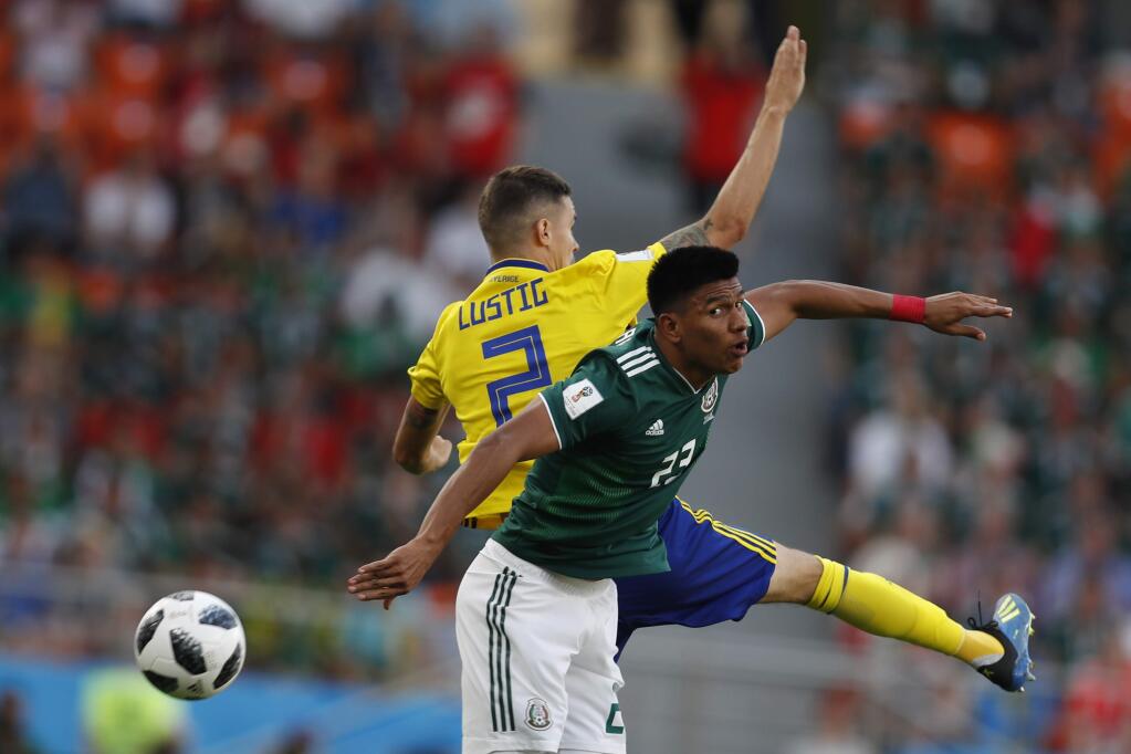 Mexico's Jesus Gallardo, right, and Sweden's Mikael Lustig challenge for the ball during the Group F match between Mexico and Sweden, at the 2018 World Cup in the Yekaterinburg Arena in Yekaterinburg , Russia, Wednesday, June 27, 2018. (AP Photo/Eduardo Verdugo)