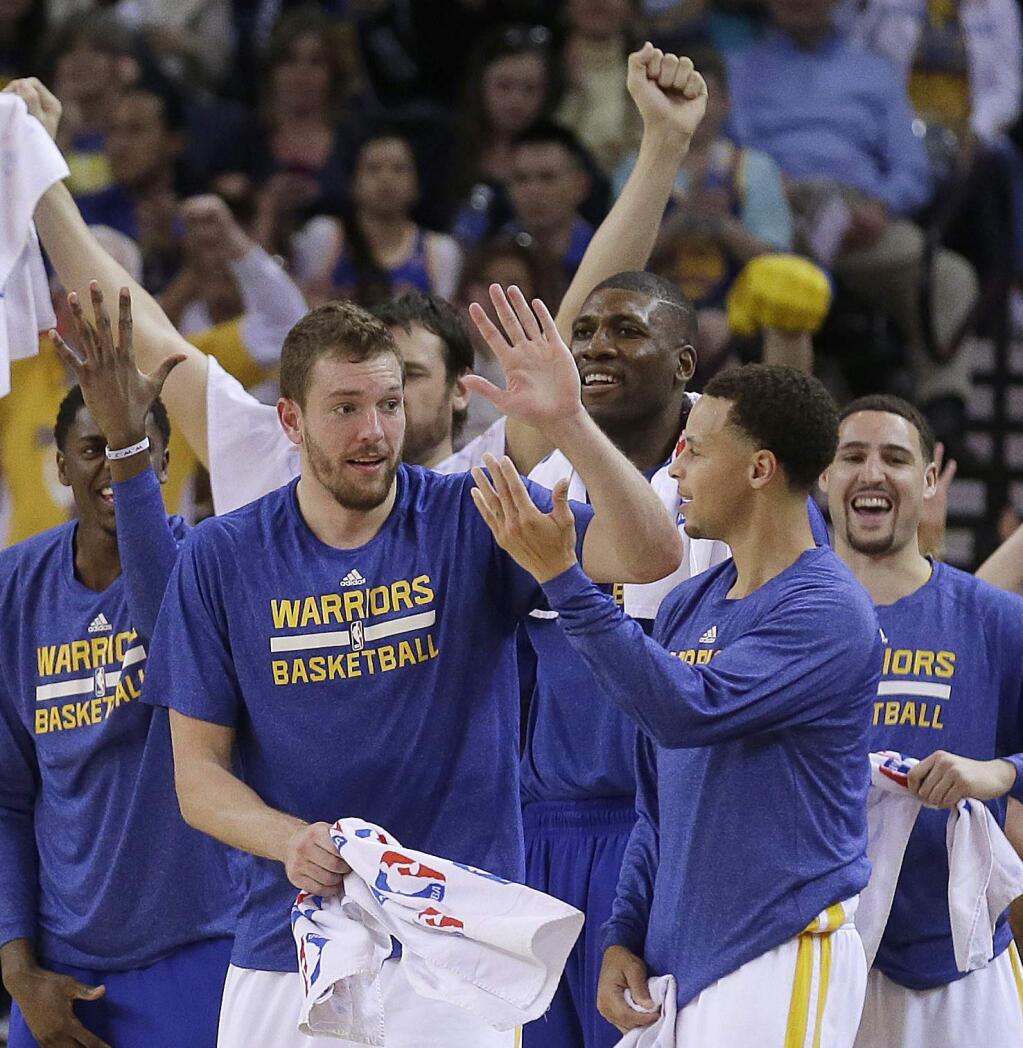 Warriors forward David Lee, left, did not play at all in the first round but said he will be ready for the second round series, which could begin as early as Sunday. (AP Photo/Ben Margot)