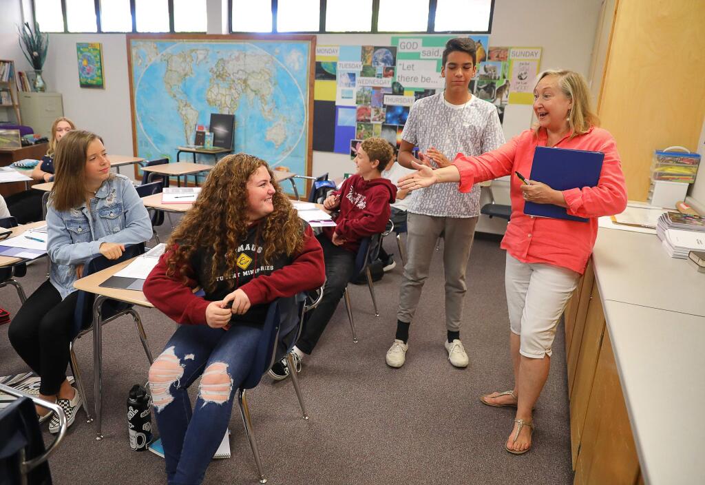 Nixie Laremore, right, discusses body language as a form of communication with students Jake Hammer and Katy Seidler during an english and science class at the new Victory Christian Academy, in Santa Rosa on Friday, September 6, 2019. (Christopher Chung/ The Press Democrat)