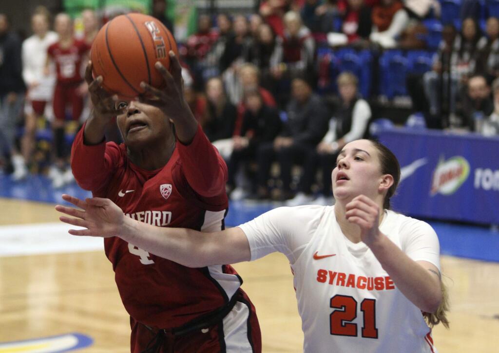 Stanford's Nadia Fingall holds on to the ball as Syracuse's Emily Engstler tries to steal it during the first half Friday, Nov. 29 2019, in Victoria, British Columbia. (Chad Hipolito/The Canadian Press via AP)