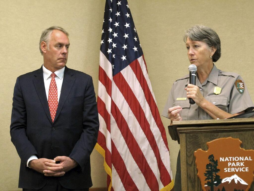 Interior Secretary Ryan Zinke, left, and Grand Canyon National Park Superintendent Chris Lehnertz address National Park Service employees Friday, Oct. 13, 2017, at Grand Canyon National Park, Ariz. A survey of Park Service employees found nearly two in five have experienced some sort of harassment or discrimination in the workplace. (AP Photo/Felicia Fonseca)