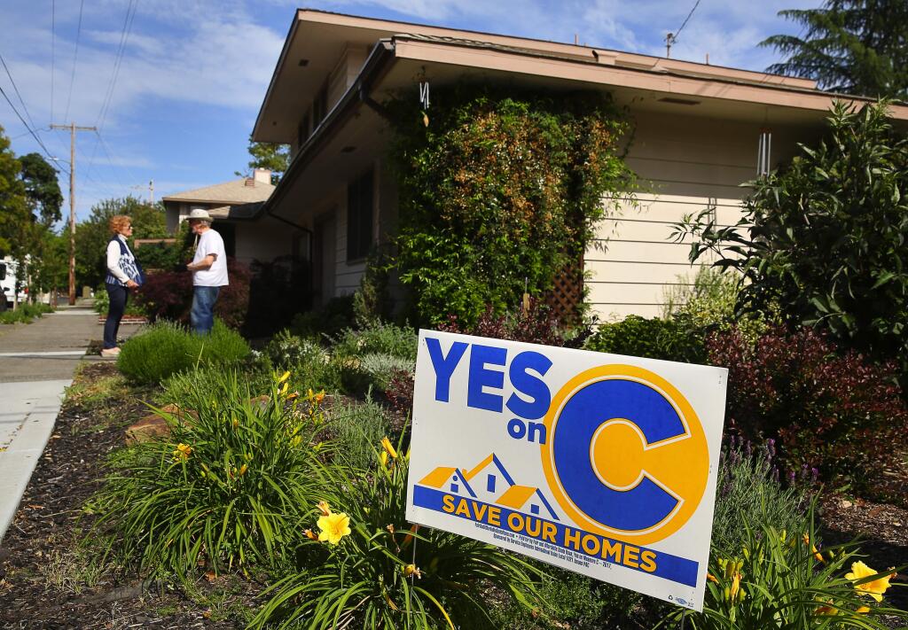 A Yes on C sign adorns a lawn along Spencer Avenue and King Street in Santa Rosa (CHRISTOPHER CHUNG / The Press Democrat)