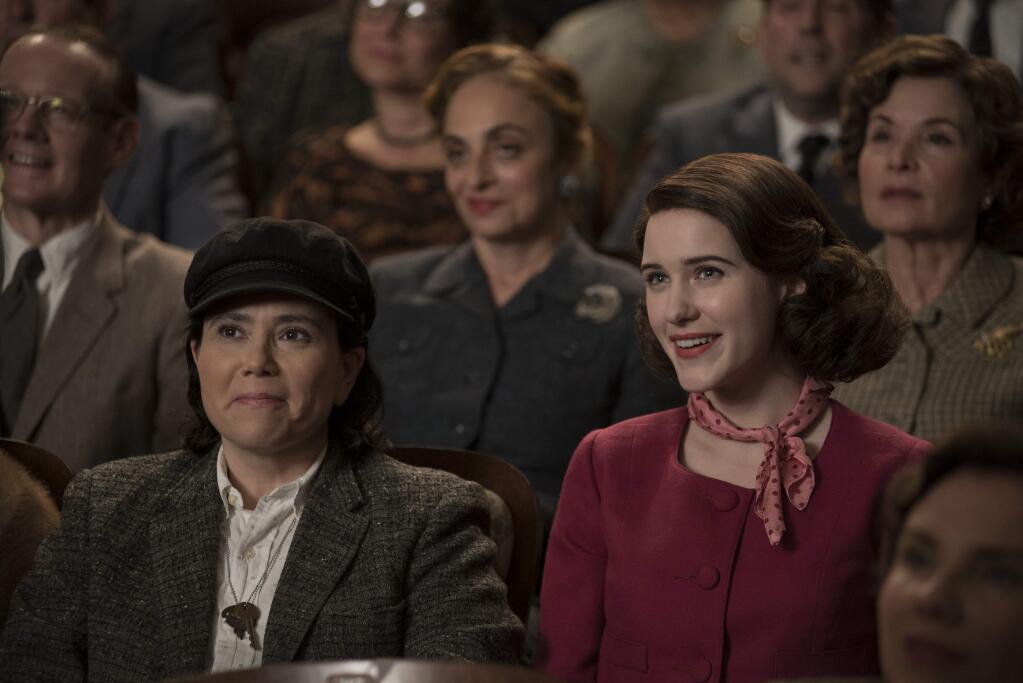 This image released by Amazon shows Alex Borstein, left, and Rachel Brosnahan in 'The Marvelous Mrs. Maisel.' (Nicole Rivelli/Amazon via AP)