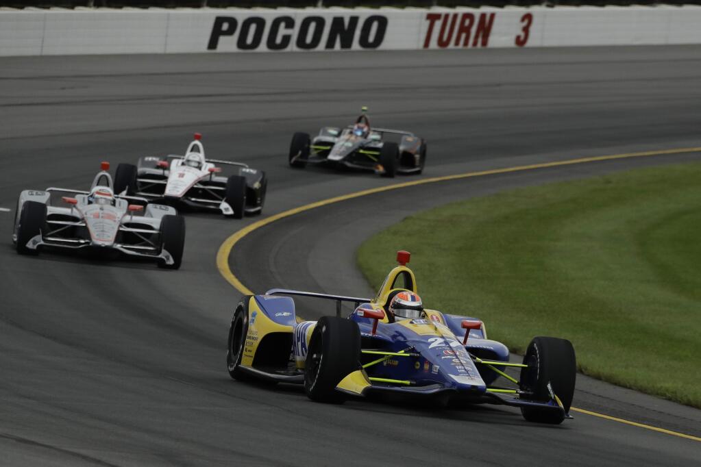Alexander Rossi leads the field during the IndyCar race at Pocono Raceway, Sunday, Aug. 19, 2018, in Long Pond, Pa. (AP Photo/Matt Slocum)