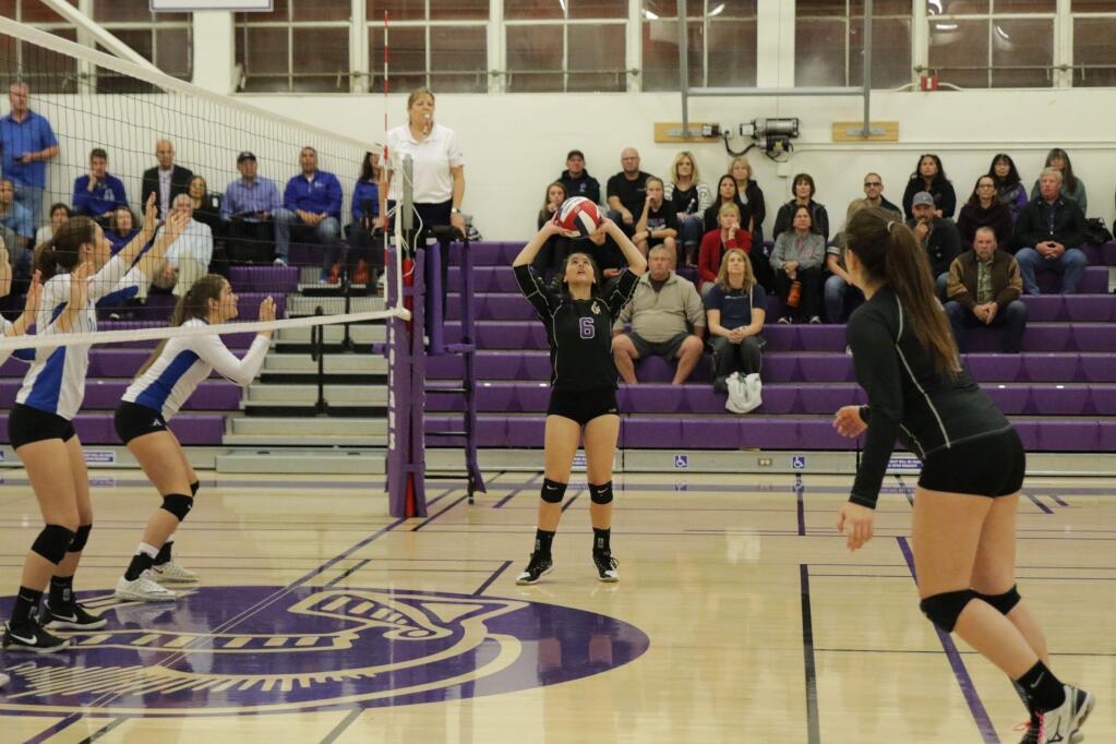 DWIGHT SUGIOKA FOR THE ARGUS-COURIERPetaluma's Serena Horvath sets up a teammate for a hit against Acalanes in the NCS playoff match held Tuesday in the Petaluma gym.