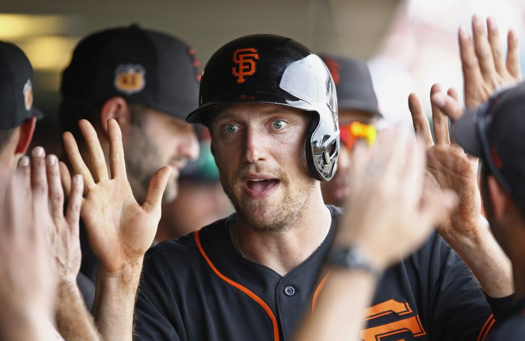 San Francisco Giants right fielder Hunter Pence celebrates his run scored against the Los Angeles Angels during the sixth inning of a spring training game Wednesday, March 15, 2017, in Scottsdale, Ariz. (AP Photo/Ross D. Franklin)