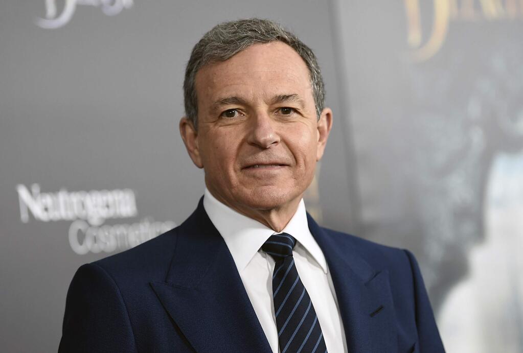 FILE - In this Monday, March 13, 2017, file photo, The Walt Disney Company CEO Robert Iger attends a special screening of Disney's 'Beauty and the Beast' at Alice Tully Hall in New York. Disney is adding more firepower to the kids streaming service expected in 2019. Iger said its Star Wars and Marvel comic-book movies will be included in the service as well as Disney and Pixar movies and TV shows. In the U.S., that will be the only way to stream those films on demand. (Photo by Evan Agostini/Invision/AP, File)