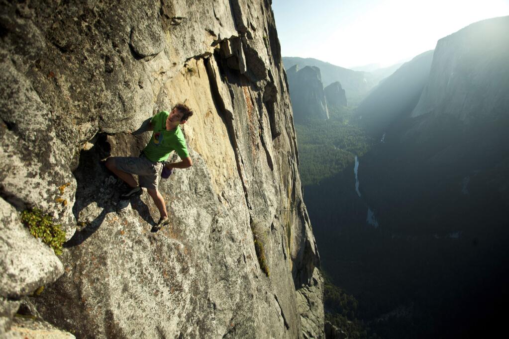 In a handout photo from 2011, Alex Honnold climbs without the aid of ropes in Yosemite. (Peter Mortimer via The New York Times)