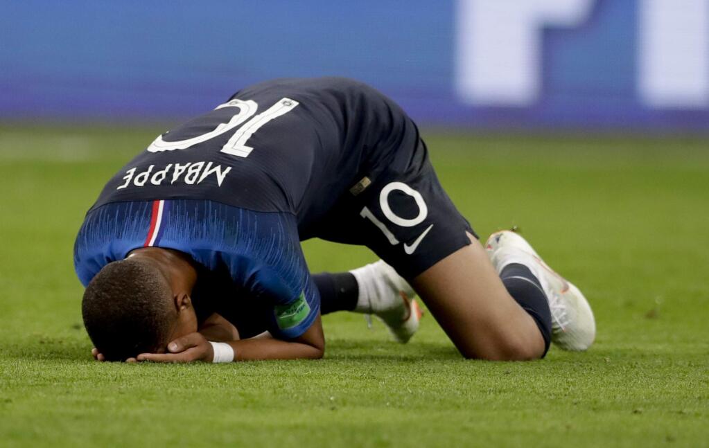 France's Kylian Mbappe celebrates at the end of the semifinal match between France and Belgium at the 2018 soccer World Cup in the St. Petersburg Stadium, in St. Petersburg, Russia, Tuesday, July 10, 2018. France won 1-0. (AP Photo/Petr David Josek)