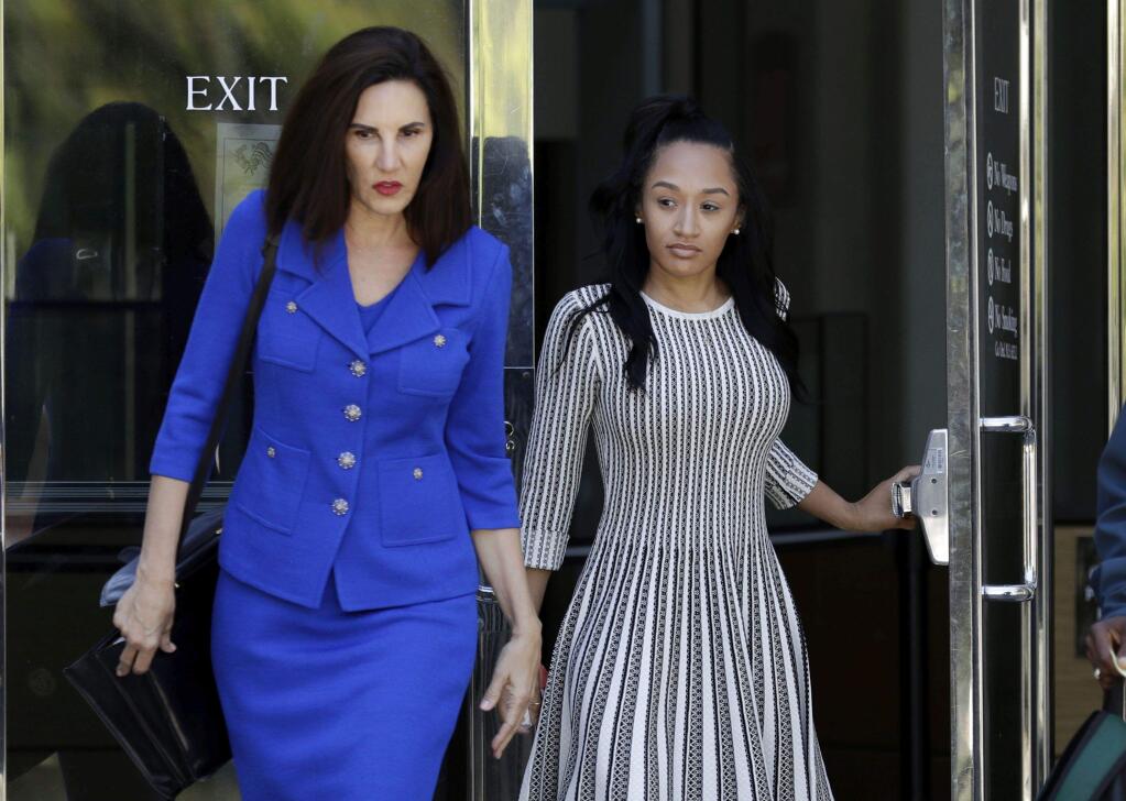 Elissa Ennis, right, former girlfriend of San Francisco 49ers linebacker Reuben Foster, walks out of Santa Clara County Superior Court with her attorney Stephanie Rickard after testifying in Foster's preliminary hearing, Thursday, May 17, 2018, in San Jose, Calif. Foster pleaded not guilty Tuesday, May 8, 2018, to charges stemming from allegations that he attacked Ennis in their home in February. (AP Photo/Marcio Jose Sanchez)
