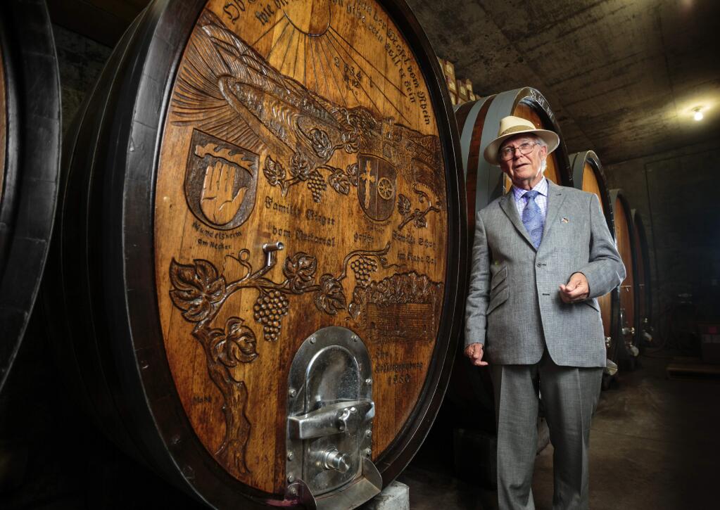 Walter Schug of Schug winery with carved wine barrel showing the Schug family roots