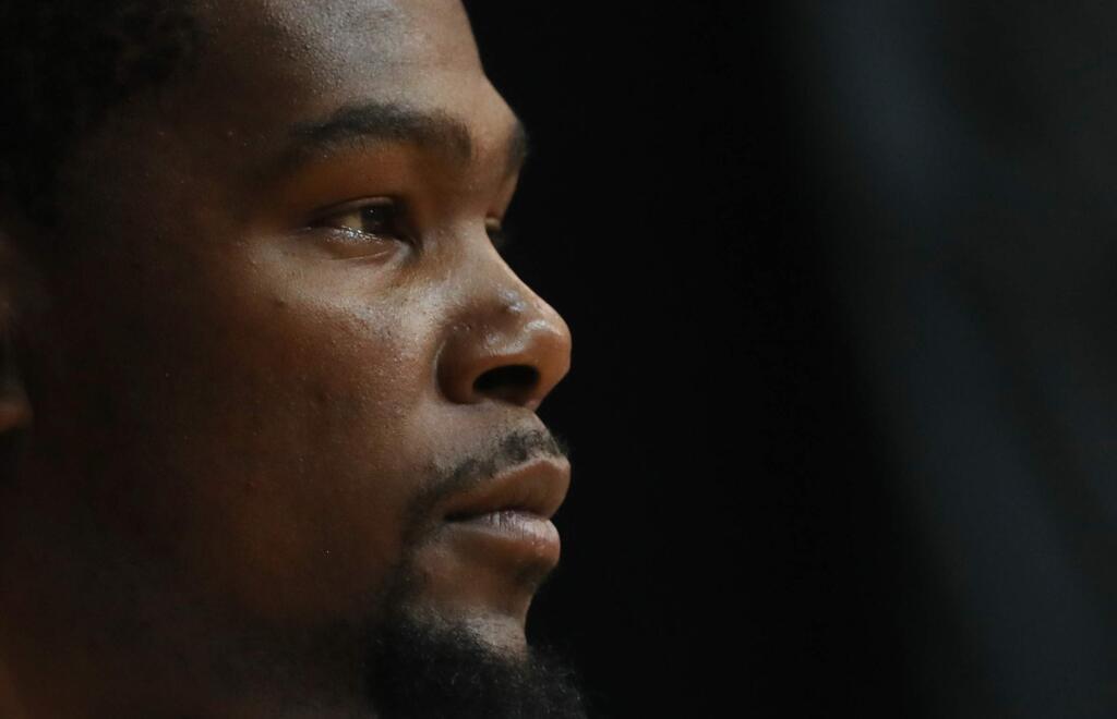 In this July 12, 2016, file photo, Kevin Durant participates in a fans meeting event in Hong Kong. Even in a jersey with “USA” on the chest, Durant got some boos from the Clippers and Lakers fans at Staples Center for an exhibition blowout of China. Durant claimed he didn't hear it, and the Americans' top scorer knows he'll get nothing but love Tuesday, July 26, when he plays at Oracle Arena for the first time since joining the Golden State Warriors. (AP Photo/Kin Cheung, File)