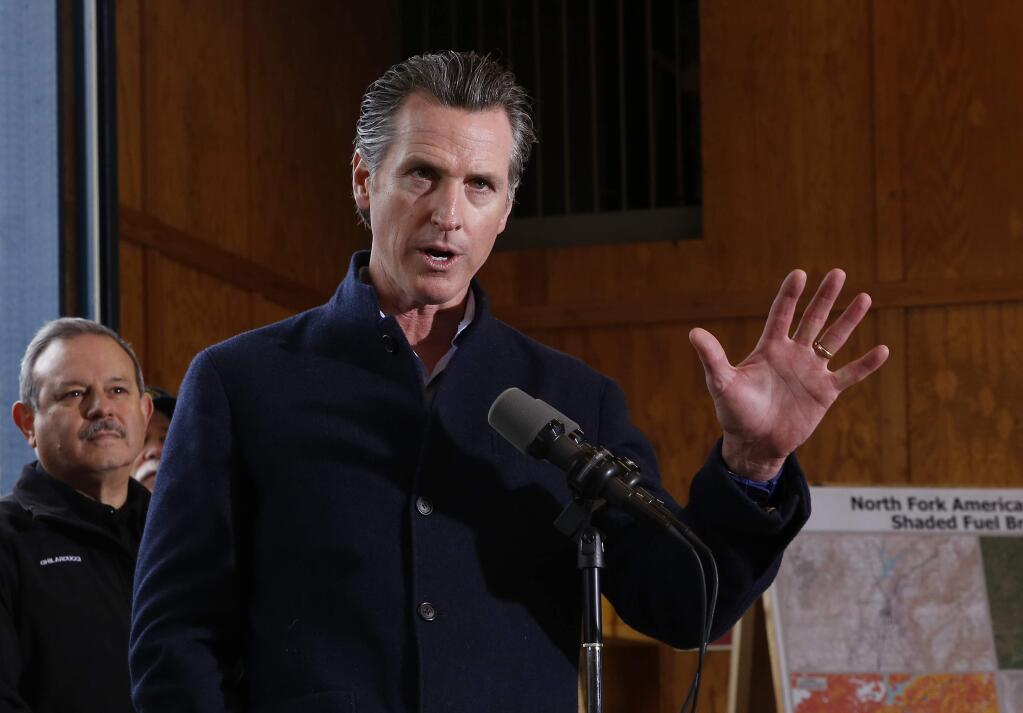 Gov. Gavin Newsom discusses emergency preparedness during a visit to the California Department of Forestry and Fire Protection CalFire Colfax Station Tuesday, Jan. 8, 2019, in Colfax, Calif. (AP Photo/Rich Pedroncelli)