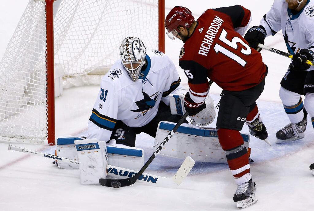 San Jose Sharks goalie Martin Jones makes a save on a shot by Arizona Coyotes center Brad Richardson (15) during the second period Wednesday, Nov. 22, 2017, in Glendale, Ariz. (AP Photo/Ross D. Franklin)
