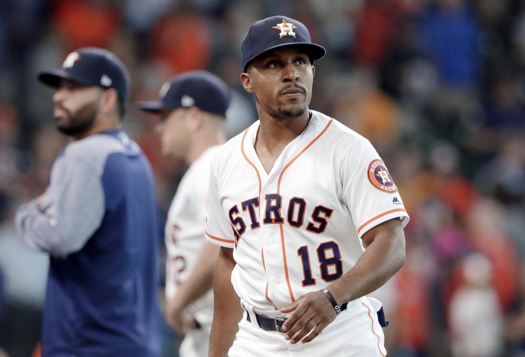 FILE - In this July 24, 2019, file photo, Houston Astros left fielder Tony Kemp (18) leaves the field after a baseball game against the Oakland Athletics in Houston. Called up in September 2017 by Houston, Kemp immediately got asked by teammates whether he wanted to be a part of the Astros' sign-stealing scheme. His answer was no, and Kemp didn't feel further pressure to do it. The second baseman arrived Friday in Oakland spring training camp and reunited with former Astros teammate Mike Fiers, who went public in November about Houston's sign stealing. (AP Photo/Michael Wyke, File)